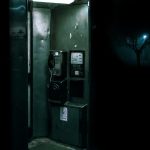 green and black telephone booth