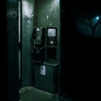green and black telephone booth
