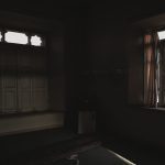 Dark room with open windows casting soft light and shadows creating a moody atmosphere.